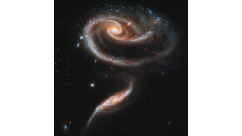 SMALL GALAXY ATTRACTS AND TRANSFORMS LARGE GALAXY